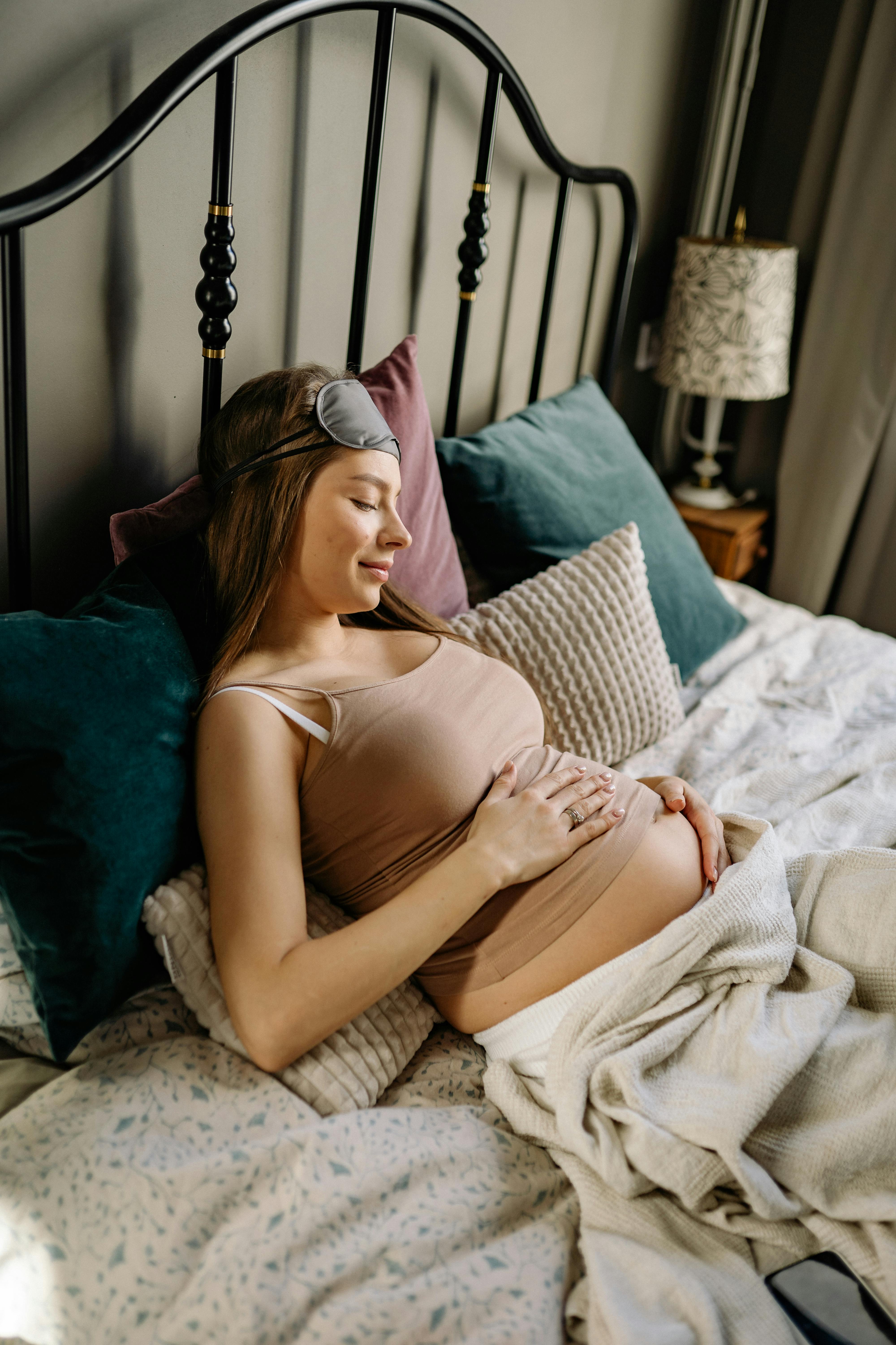 pregnant lady laying on dreamyo pillow 